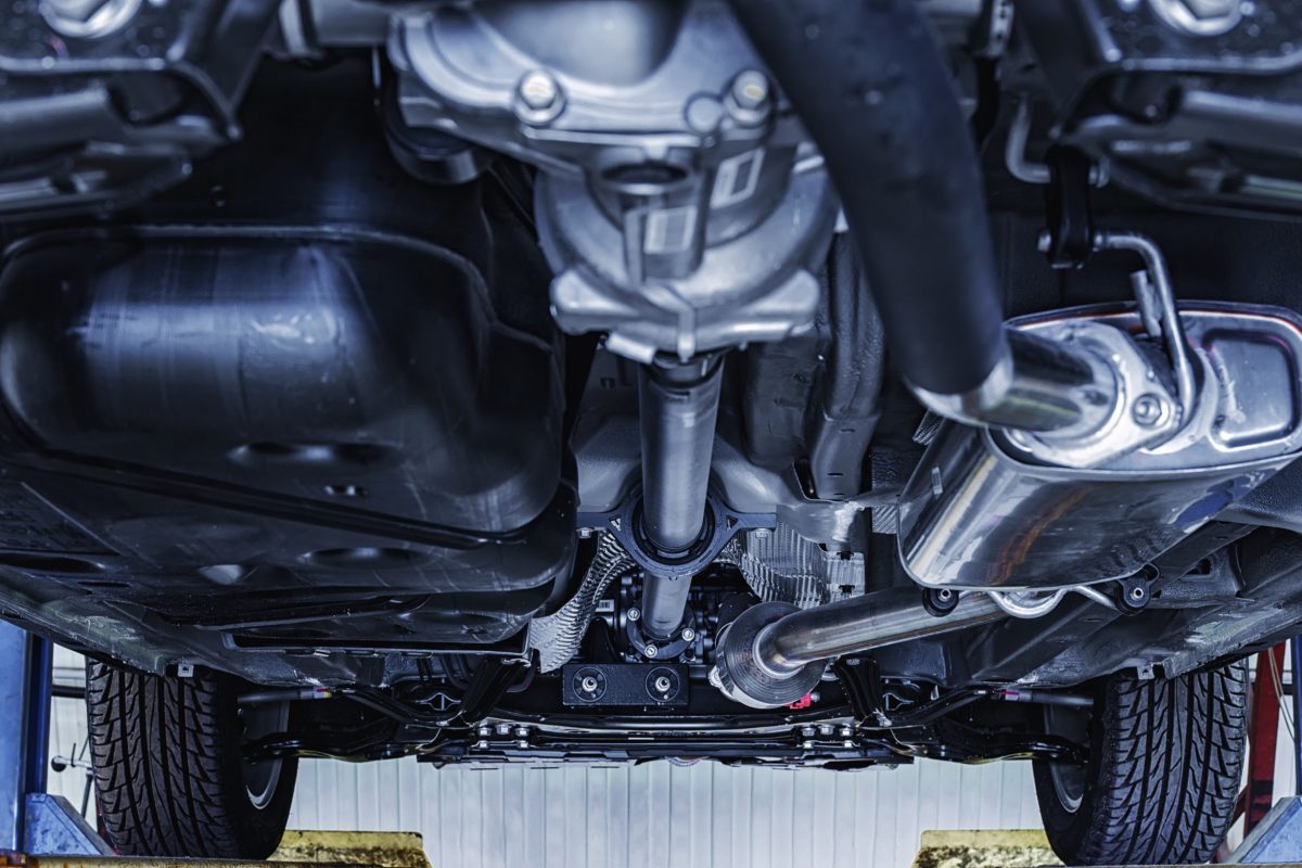 view of the car from below on the lift at shallow depth of field